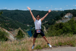 Athlete jumping for joy at the 2014 Auburn Triathlon